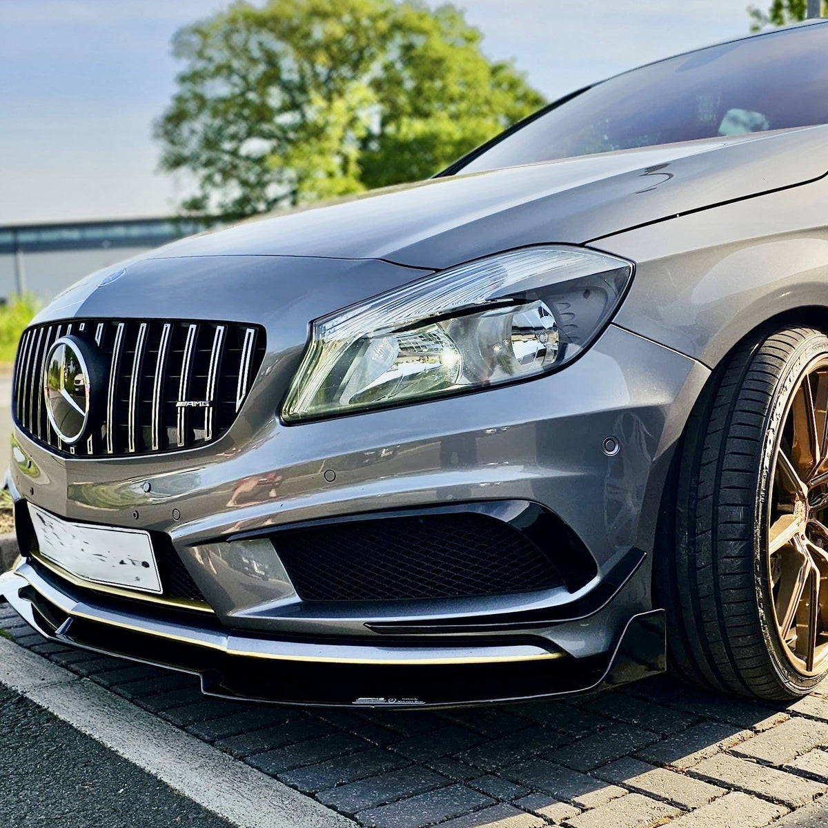 Gloss Black front splitter for Mercedes Benz W176 A Class 2013-2015, enhancing sporty appearance and aerodynamic performance.
