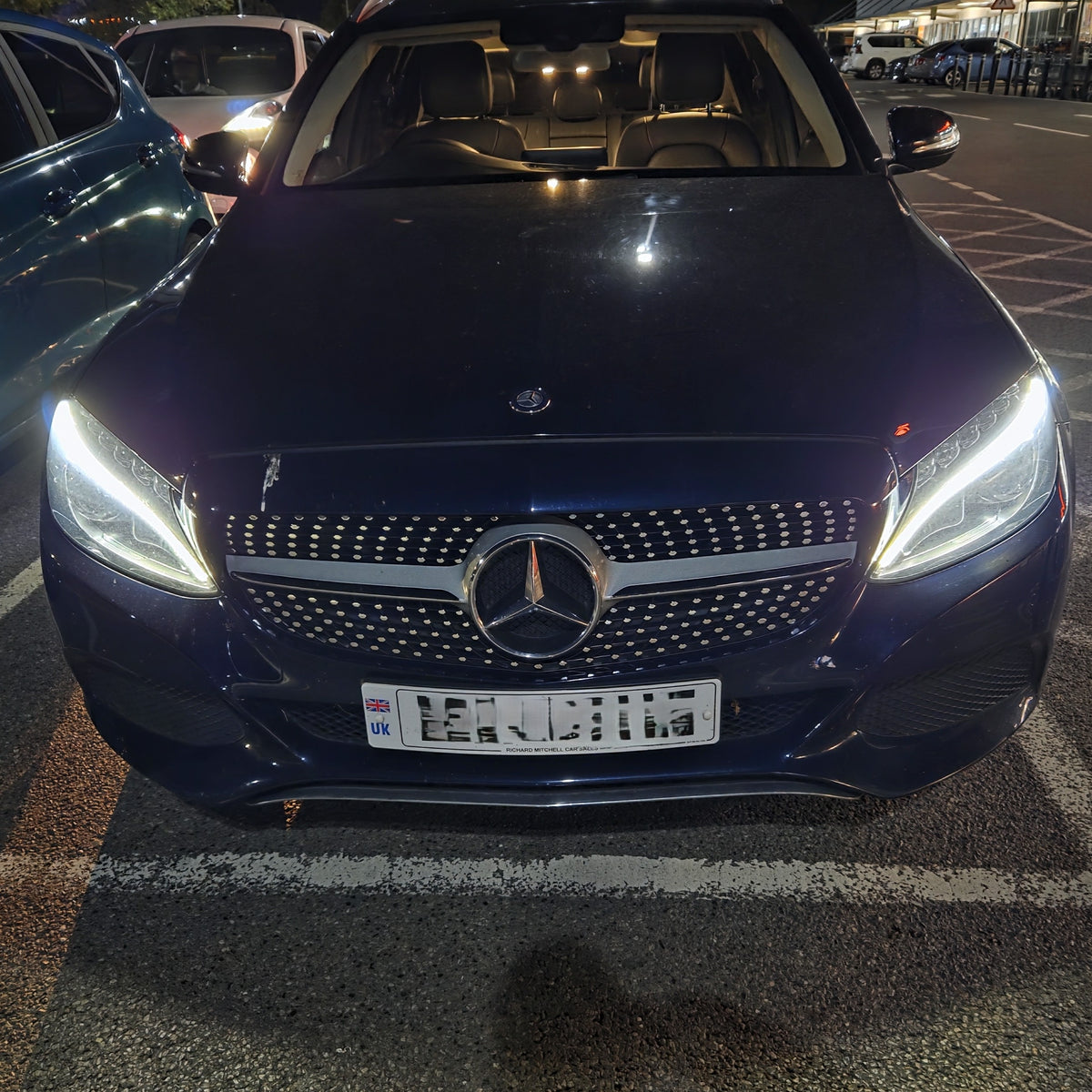 Gloss black diamond style front grille for Mercedes Benz W205 C Class 2014-2018, featuring a sleek, modern design.
