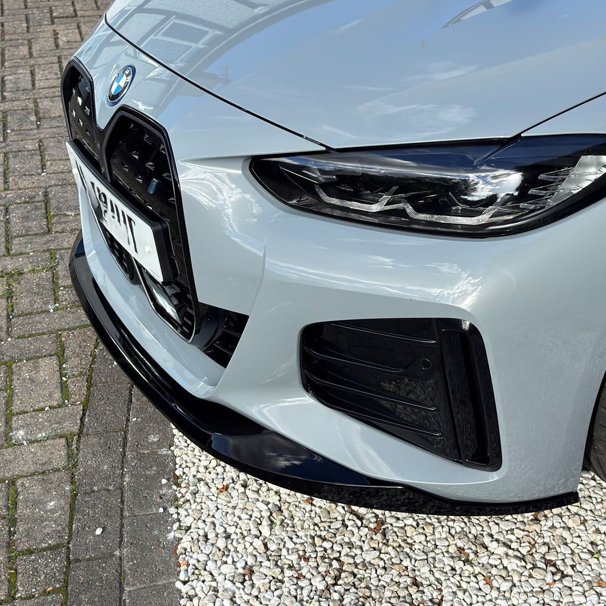 Gloss Black front splitter for BMW 4 Series G26 Gran Coupe and i4, designed for sporty aerodynamic enhancement.