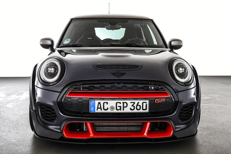 AC Schnitzer front splitter for MINI F56 GP, aerodynamic upgrade, black carbon fiber finish, mounted on car front.