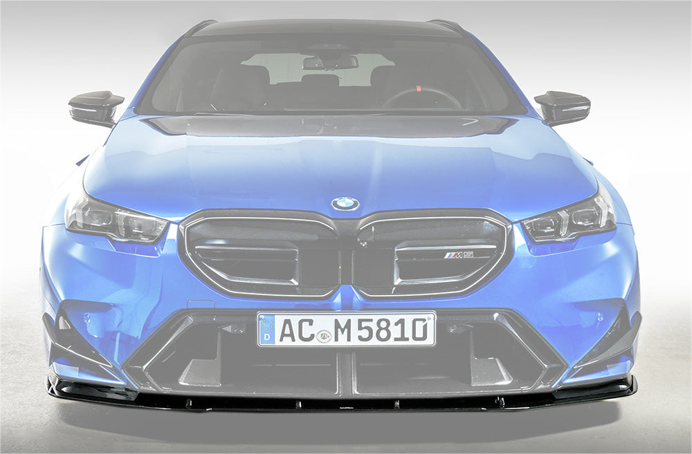 AC Schnitzer front splitter for BMW M5 G90, aerodynamic upgrade, black carbon fiber with sleek design and mounting details visible.