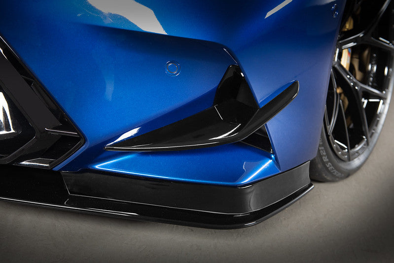 AC Schnitzer front side wings for BMW M5 G90/G99, aerodynamic carbon fiber accents on the vehicle's front sides.