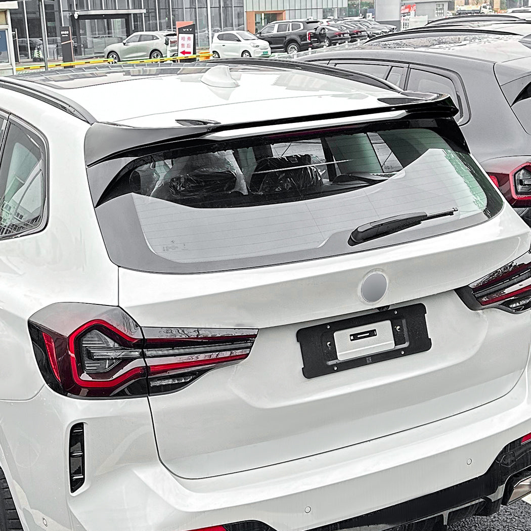Gloss Black roof spoiler for BMW G01 X3 and iX3, enhances vehicle aerodynamics with a sleek, sporty design.