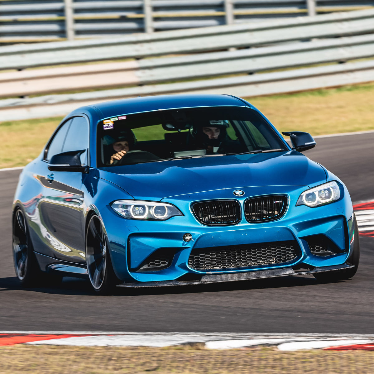 Carbon fibre front splitter for BMW F87 M2 GTS style, lightweight aerodynamic car part installed on the front bumper.