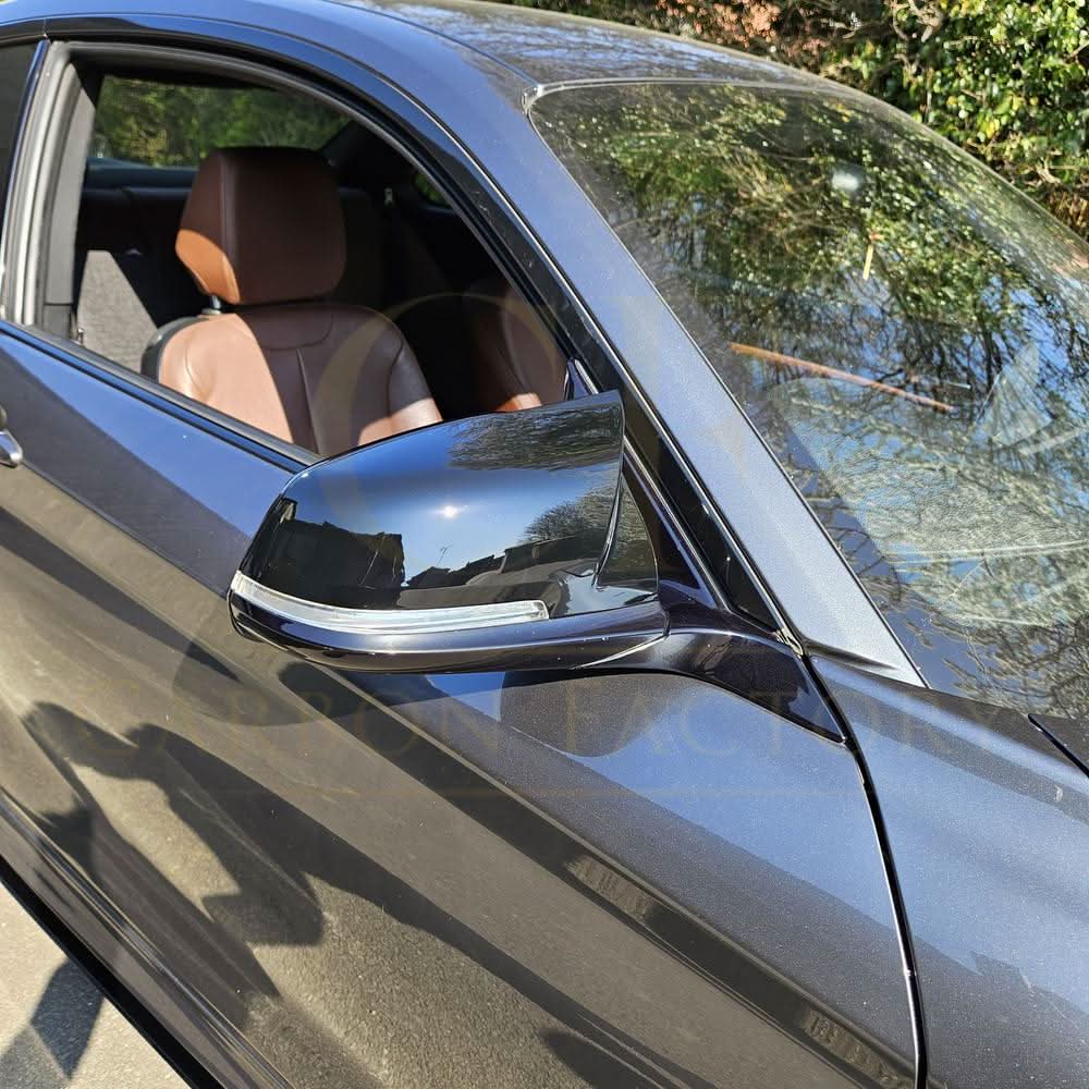 Gloss black BMW M4 style mirror covers for 1, 2, 3, and 4 series, showcasing sleek replacement mirror covers.