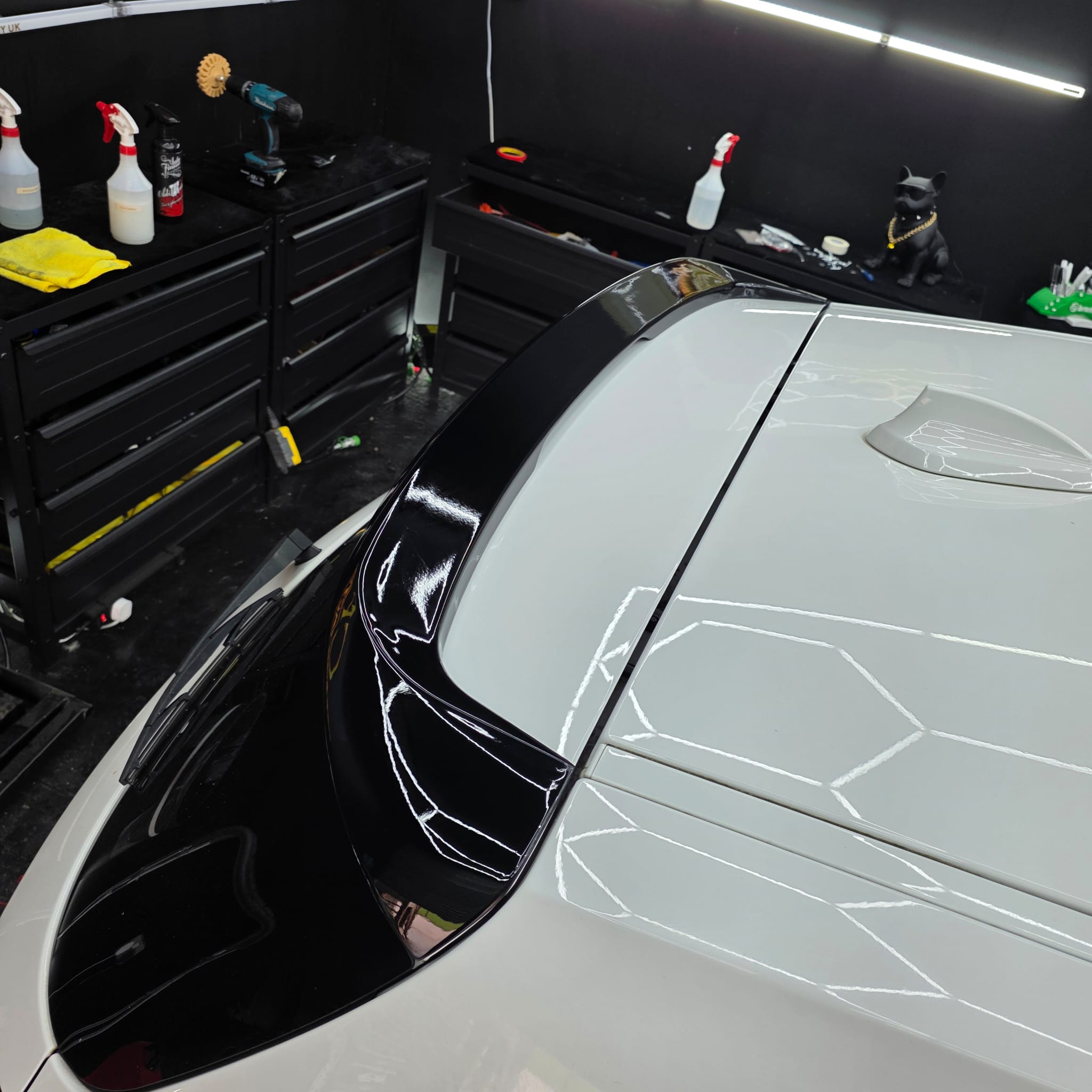 Gloss black roof spoiler for BMW F20 F21 1 Series 11-19, showcasing sleek, aerodynamic design on a black-painted car roof.