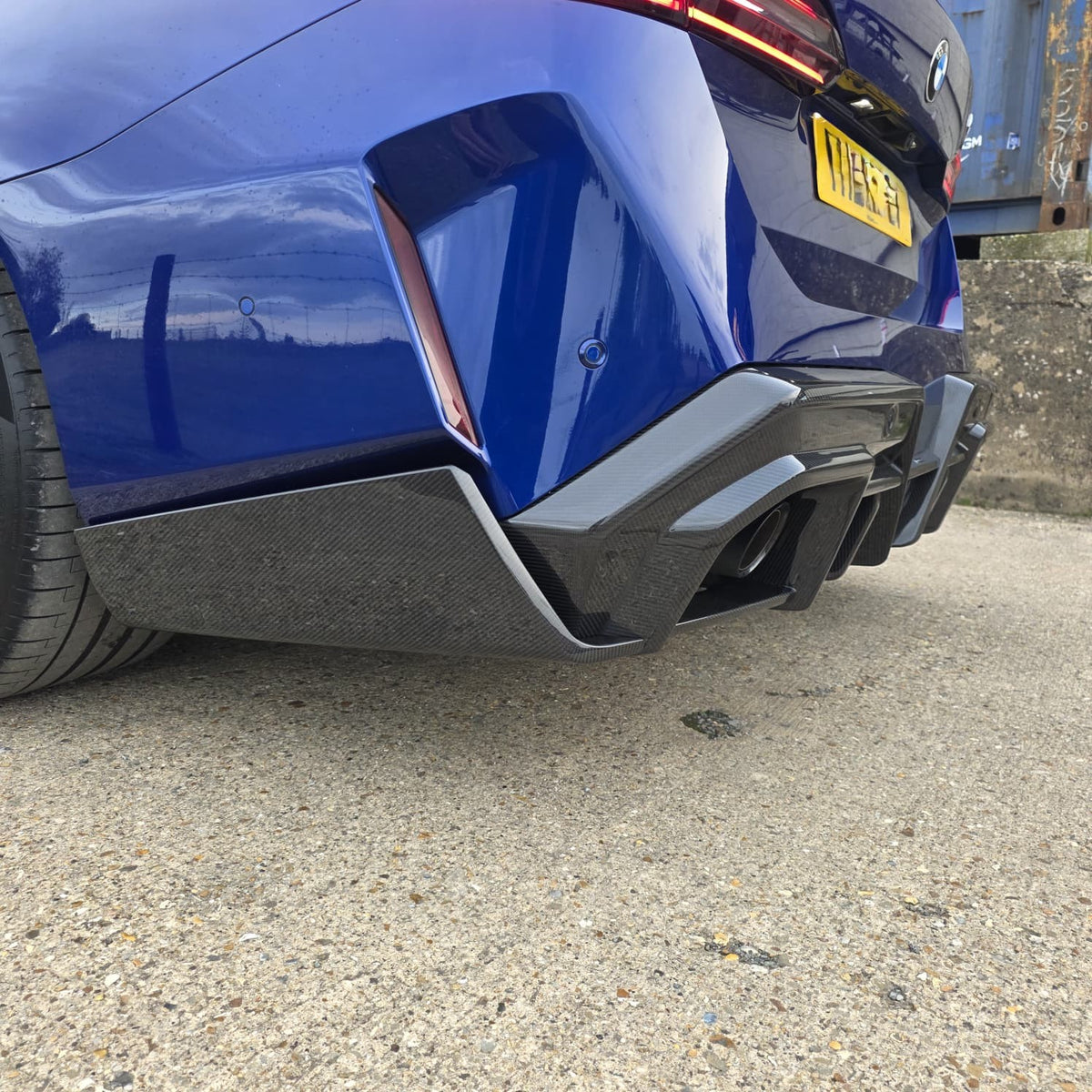 Pre-Preg Carbon fiber rear diffuser for BMW G90 G99 M5 2025+, showcasing sleek aerodynamic design and high-quality carbon finish.