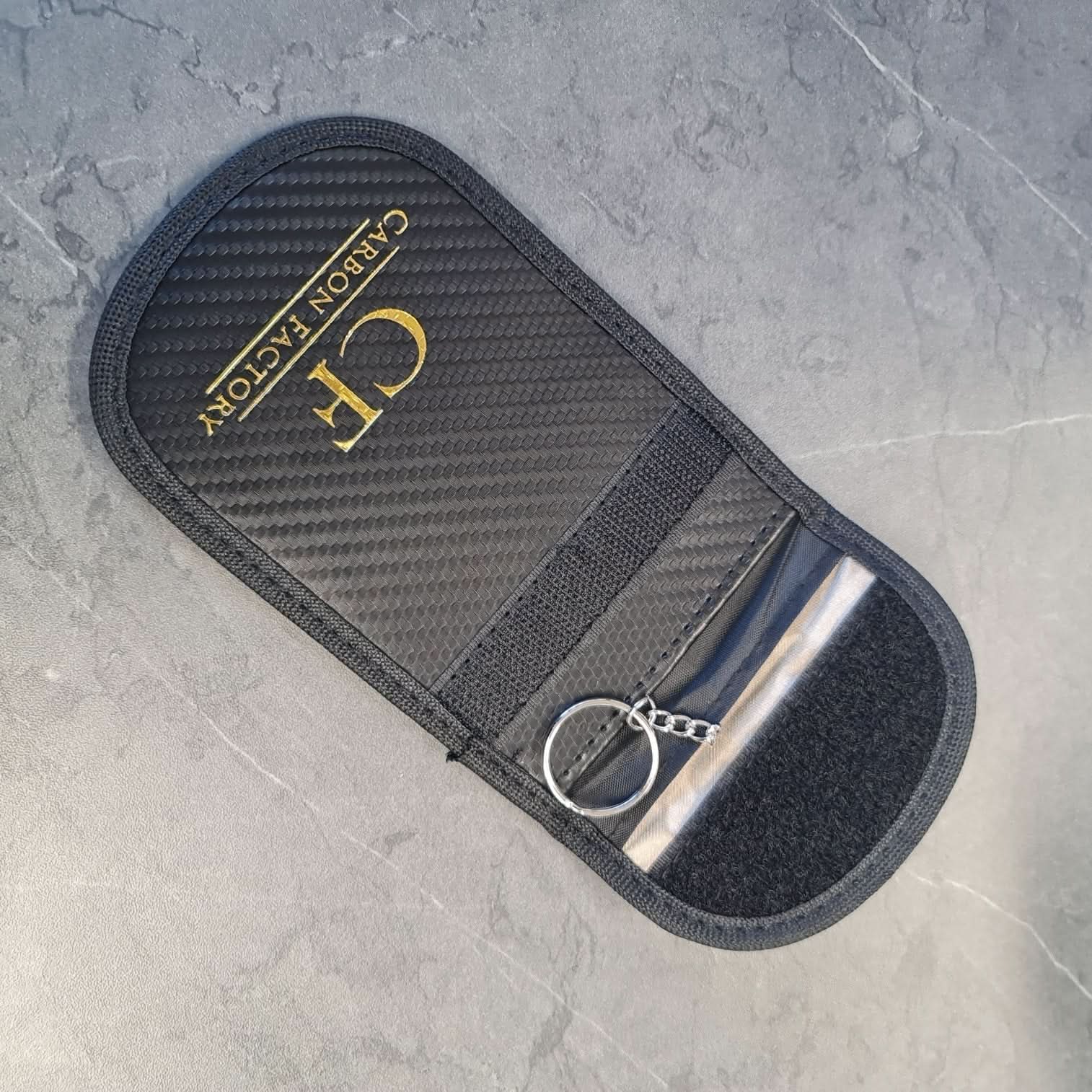 Carbon Factory car key signal blocker pouch, a protective accessory with a sleek black design for key signal shielding.