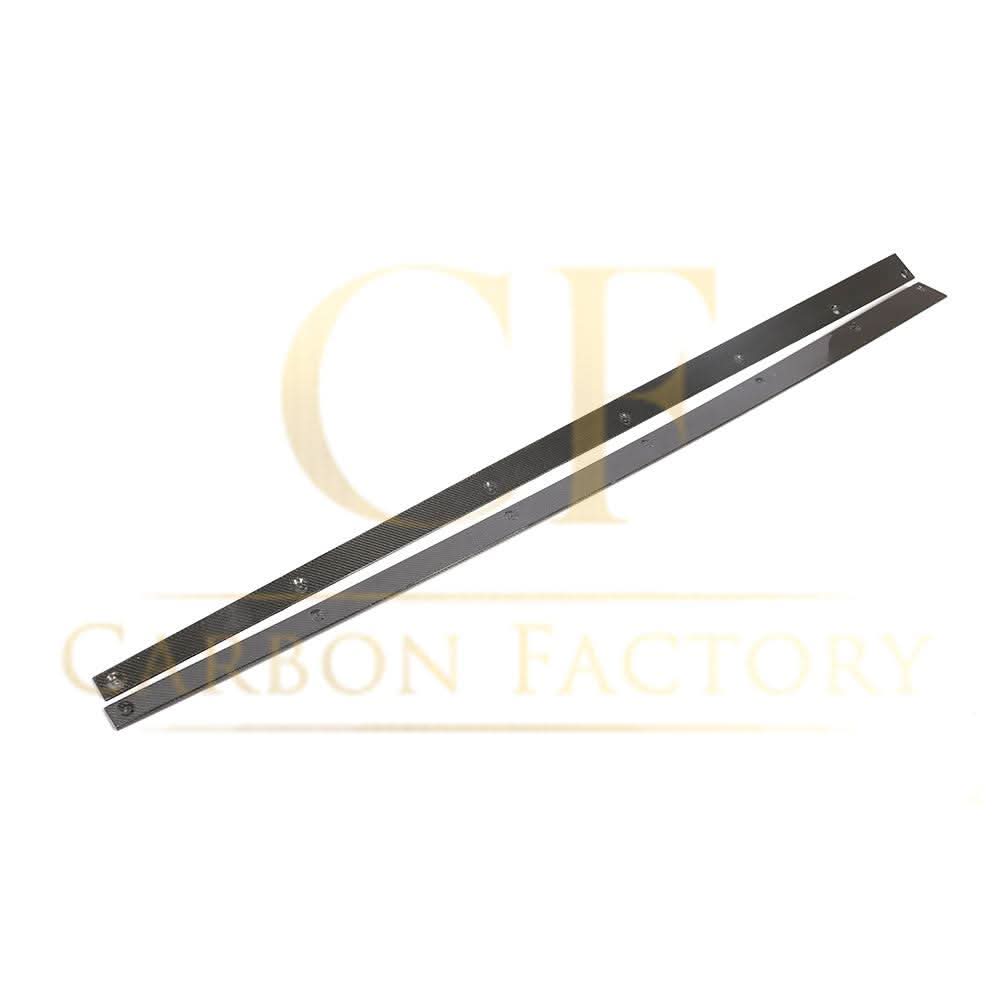 AMG-style carbon fibre side skirts for Mercedes C238 E-Class Coupe, enhances sporty look with sleek carbon fiber finish.