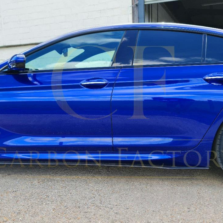 A set of universal carbon fiber side skirts for cars, featuring sleek, aerodynamic design and a glossy finish.