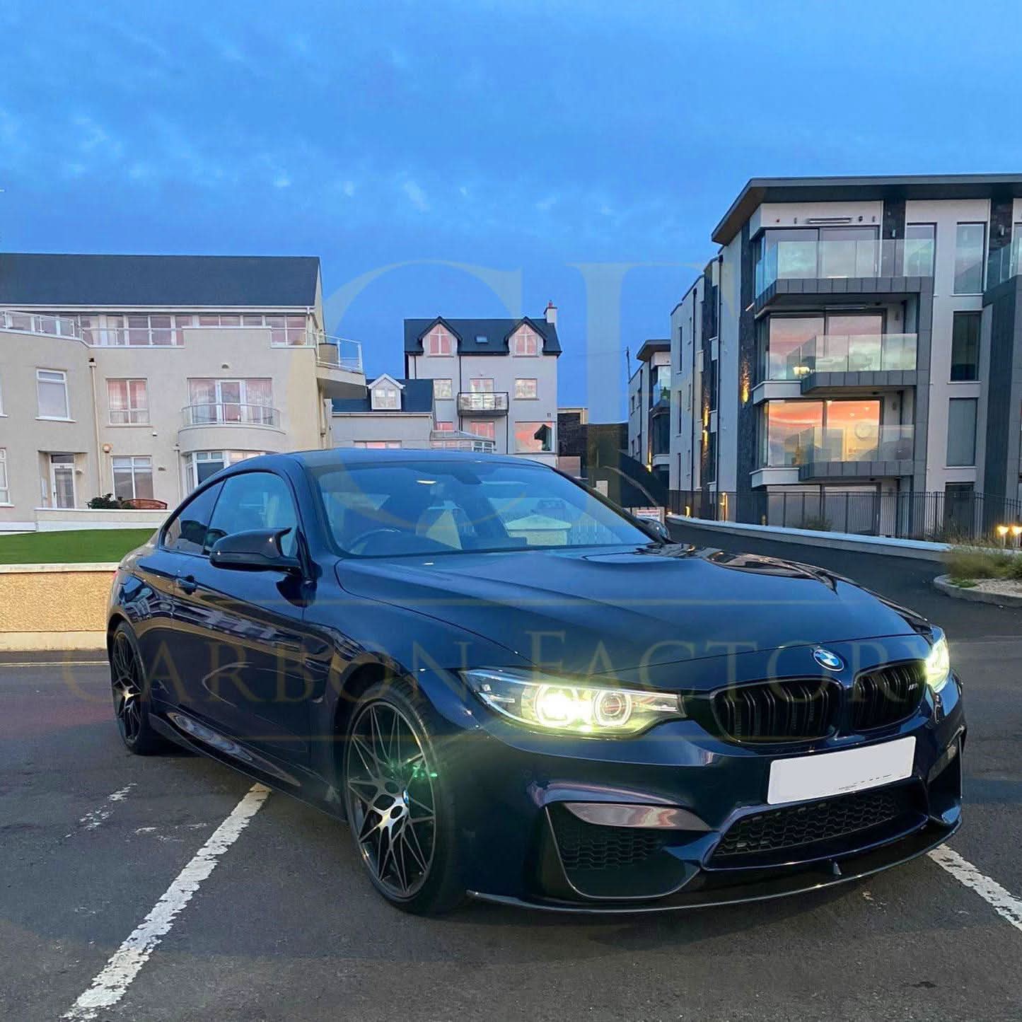 Carbon Fibre side skirt extension for BMW F82 F83 M4 (2014-2020) with sleek, textured finish visible on the car's side.