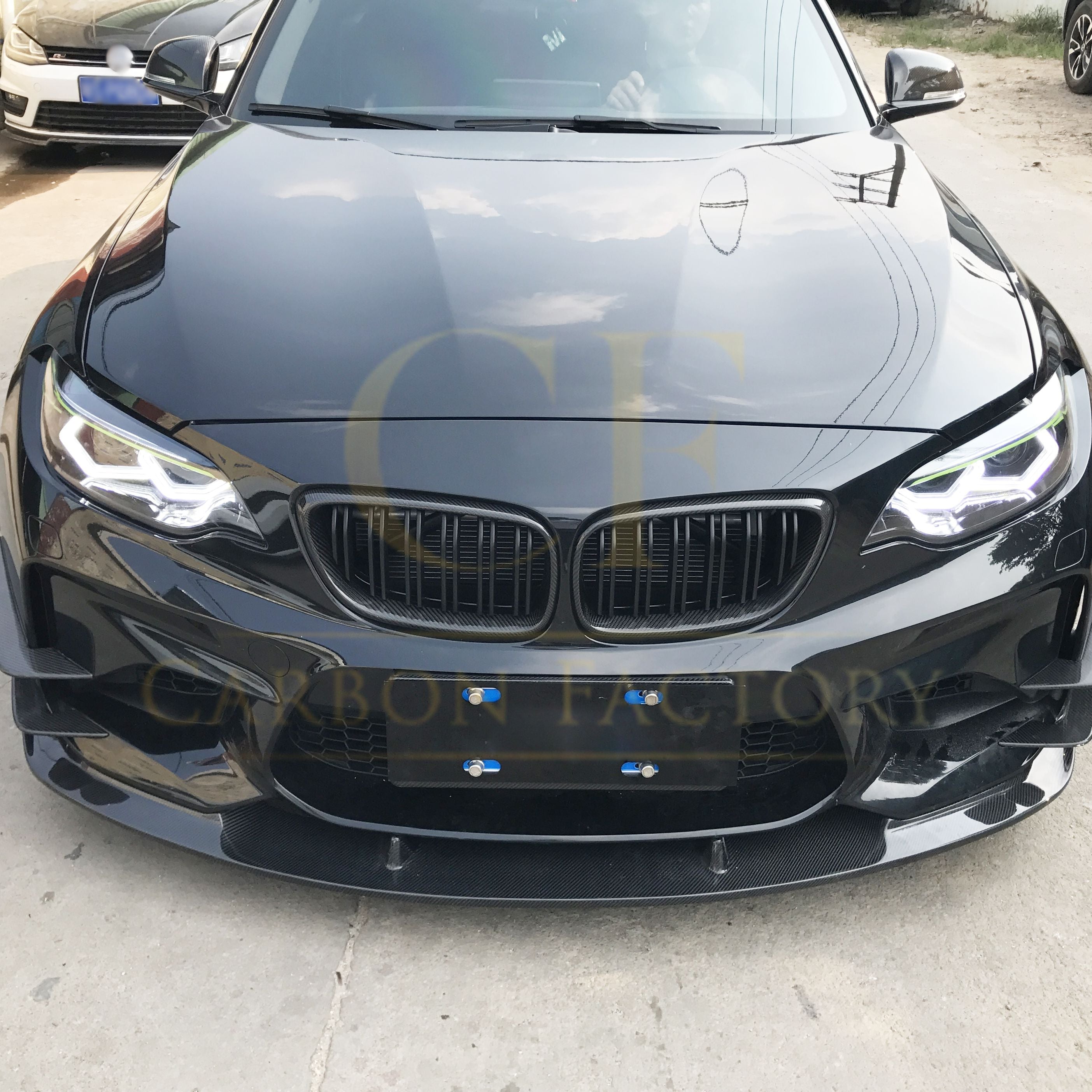 3D-style carbon fiber front splitter for BMW F87 M2 OG 2016-2018, enhancing aerodynamics and sporty look.