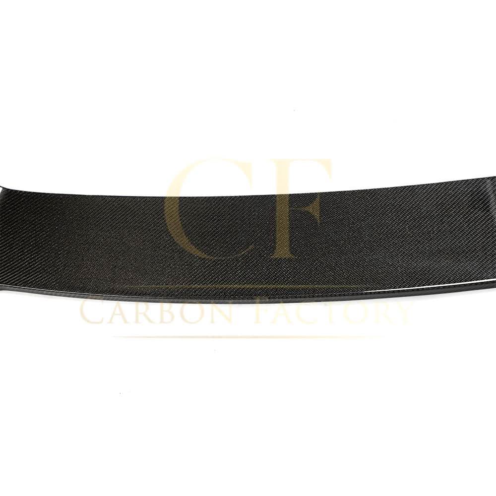 H-style carbon fiber front splitter for BMW G05 X5 2018-2022, showing sleek aerodynamic design and textured carbon fiber surface.