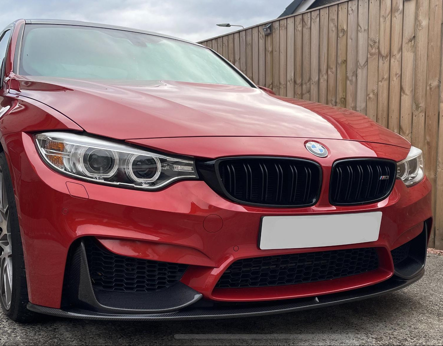 Carbon fibre front splitter for BMW F80 M3, F82 F83 M4, 1-piece design, enhances aerodynamics and sporty appearance.