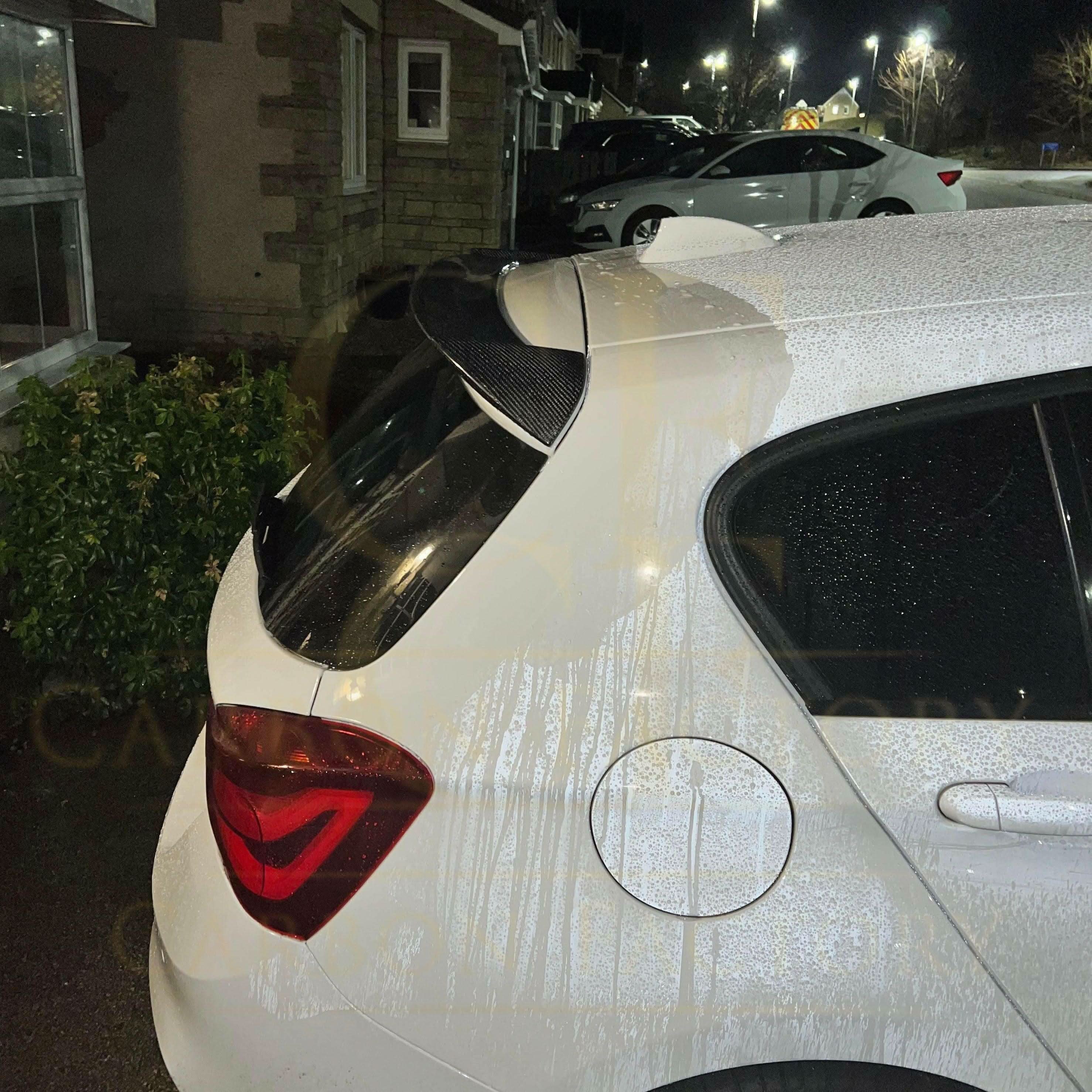 3D style carbon fibre roof spoiler for BMW 1 Series F20 F21, sporty aerodynamic design, made from high-quality carbon fibre.