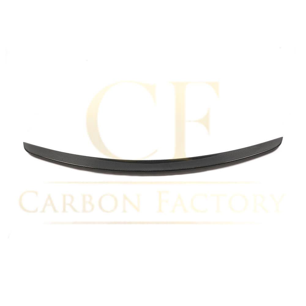 AMG-style carbon fiber boot spoiler for Mercedes-Benz C257 CLS 2019-present, showcasing a sleek, aerodynamic design on the car's trunk.