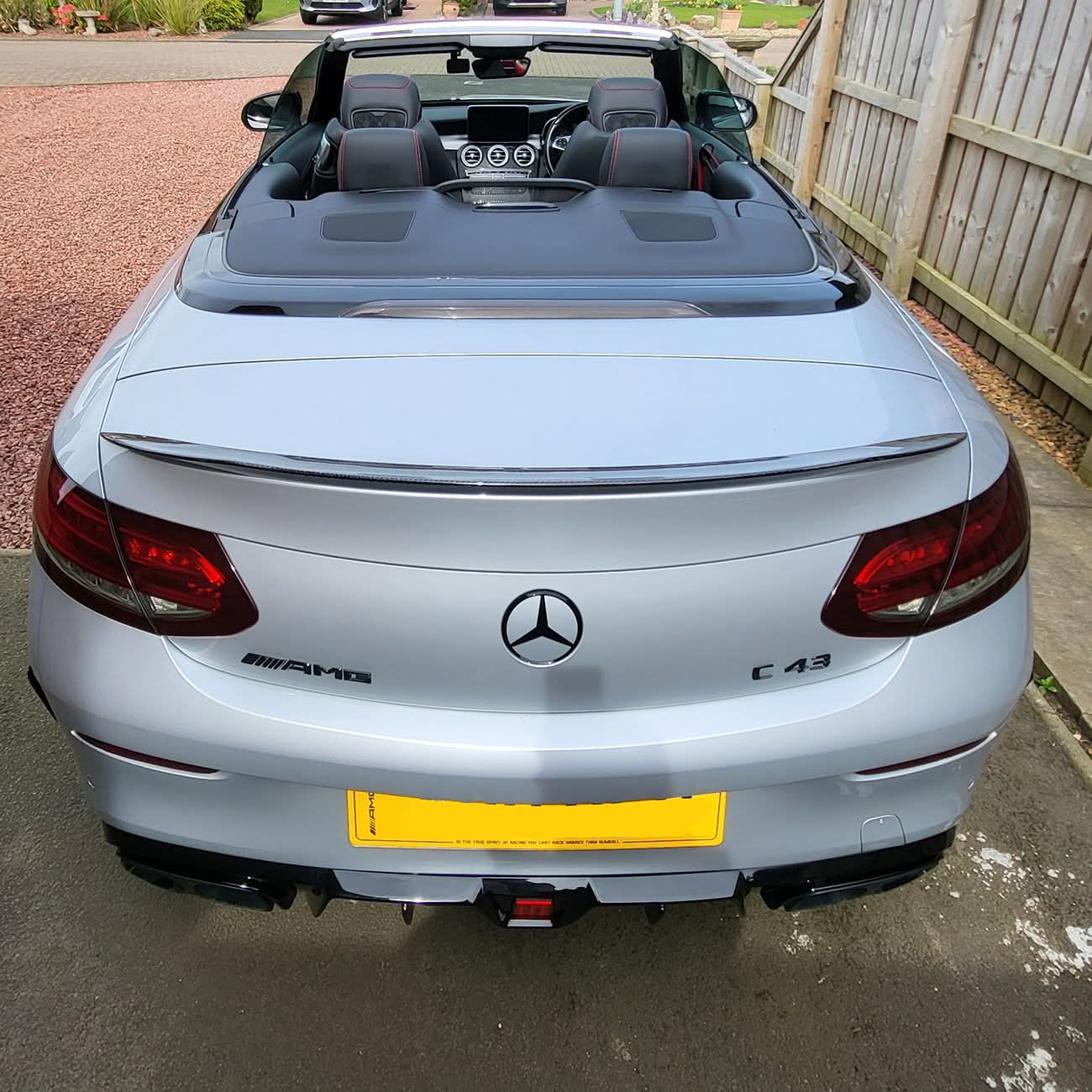 Carbon fibre boot spoiler for Mercedes Benz A205 C-Class Convertible 2015-2021, AMG style, enhances sporty look and aerodynamics.