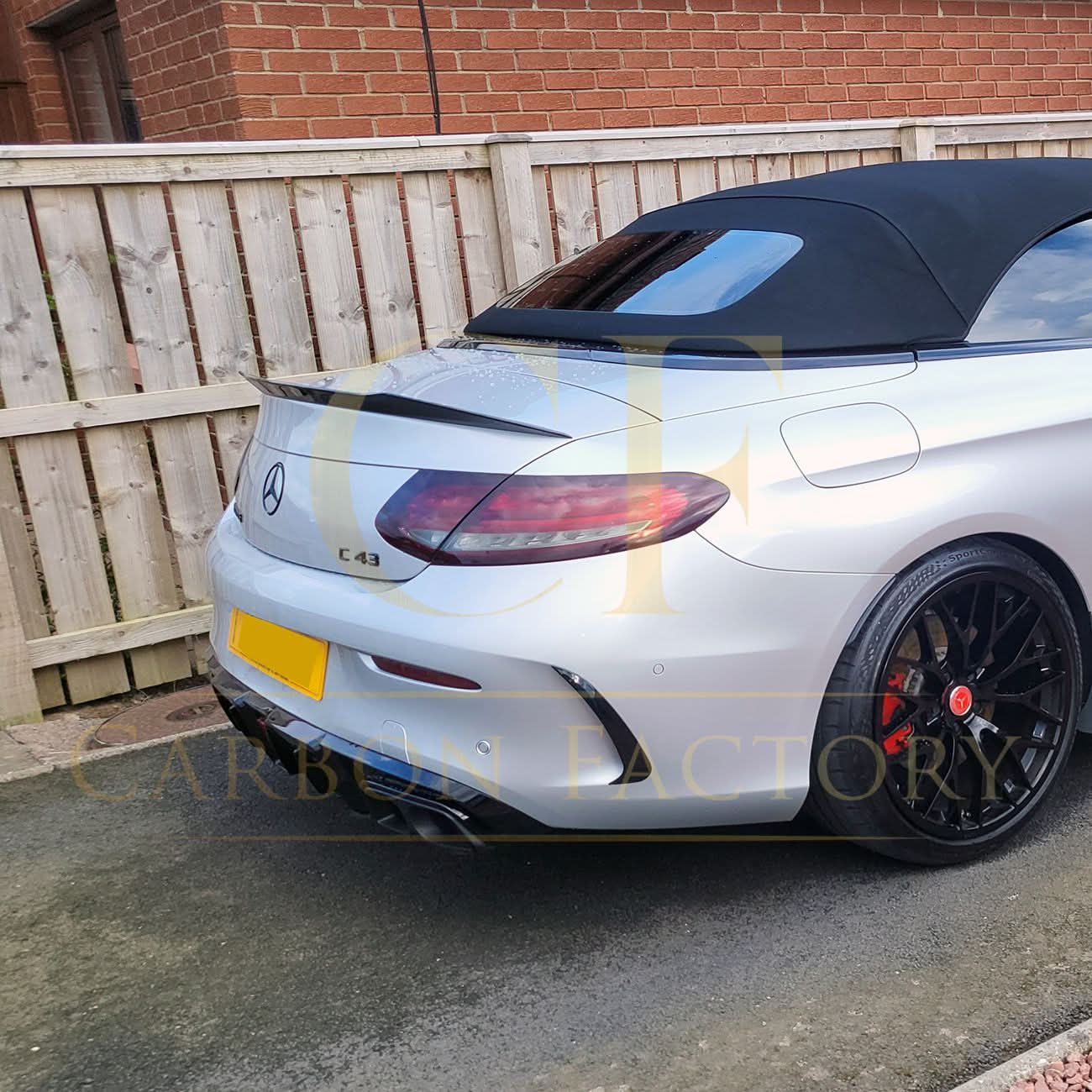 Carbon fibre boot spoiler for Mercedes Benz A205 C-Class Convertible, AMG style, enhances sporty look and aerodynamics.