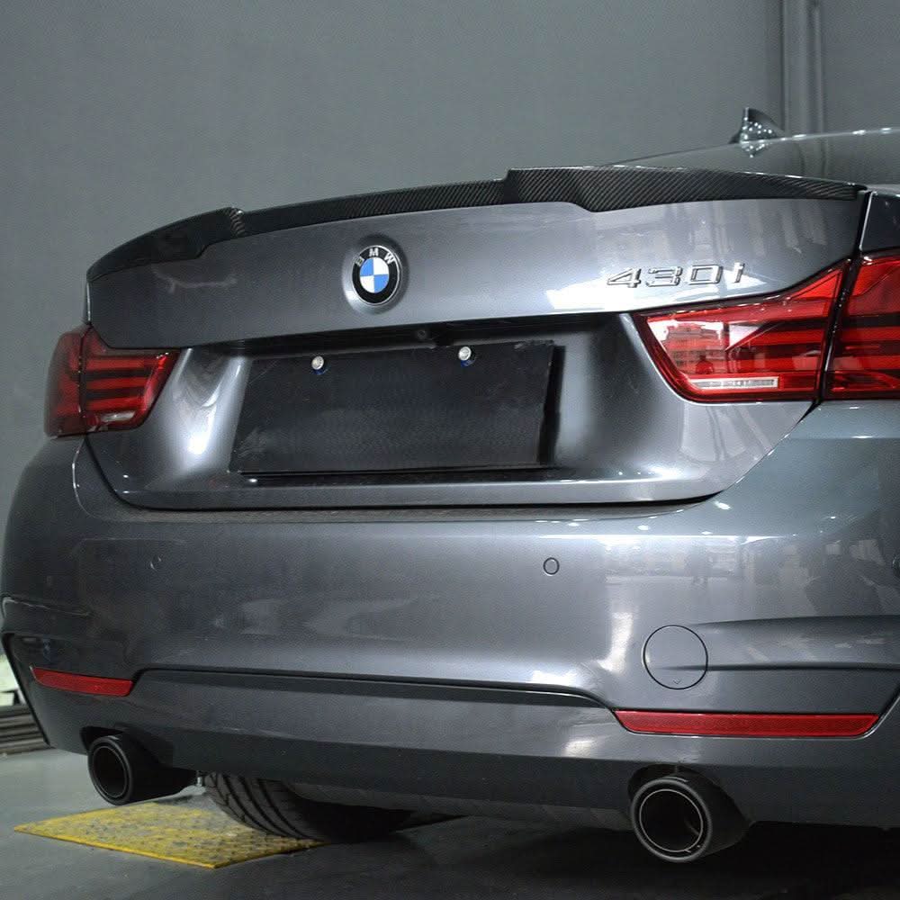 OEM style carbon fibre boot spoiler for BMW 4 Series F36 Gran Coupe, showcasing sleek, textured carbon fiber design on the rear trunk lid.