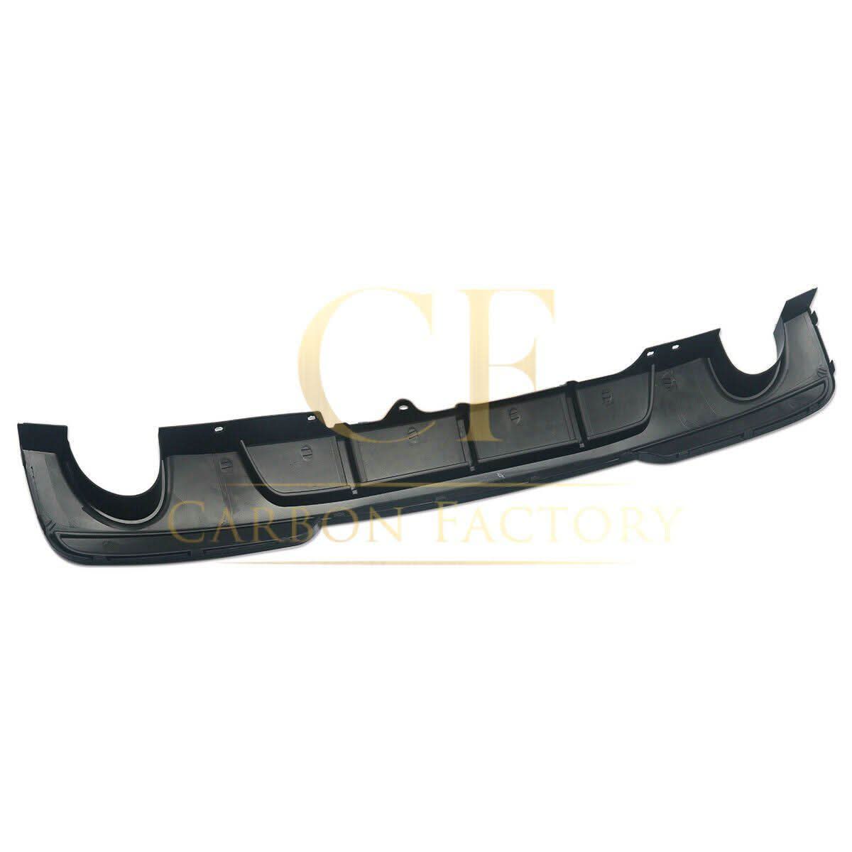 Gloss black rear diffuser with dual exhaust tips for BMW F10 5 Series (2010-2017). Stylish automotive accessory for improved look.