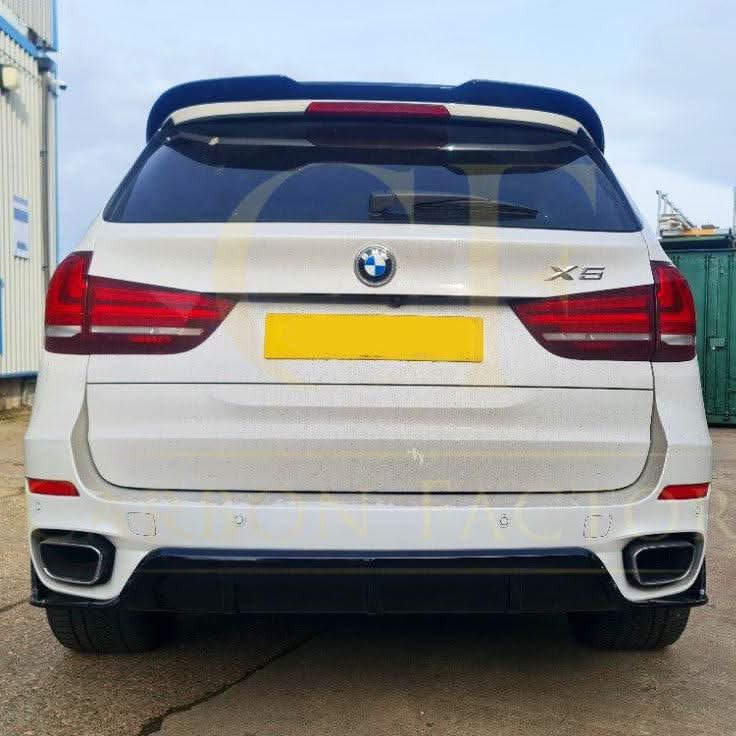Gloss black BMW F15 X5 body kit including side skirts, splitter, diffuser, and spoiler, with a sleek, carbon factory style finish.