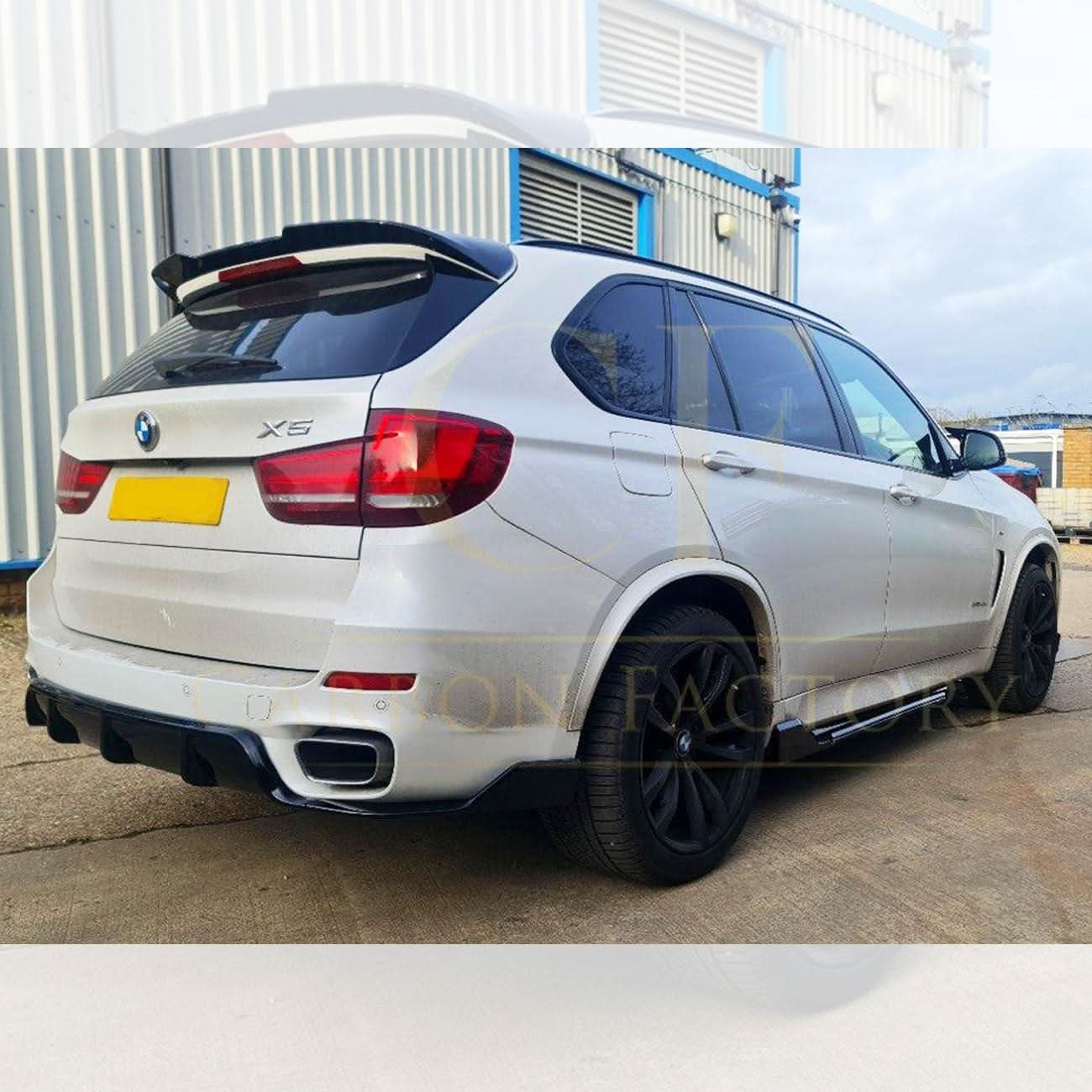 Gloss black BMW F15 X5 body kit with side skirts, splitter, diffuser, and spoiler, featuring carbon factory style design.