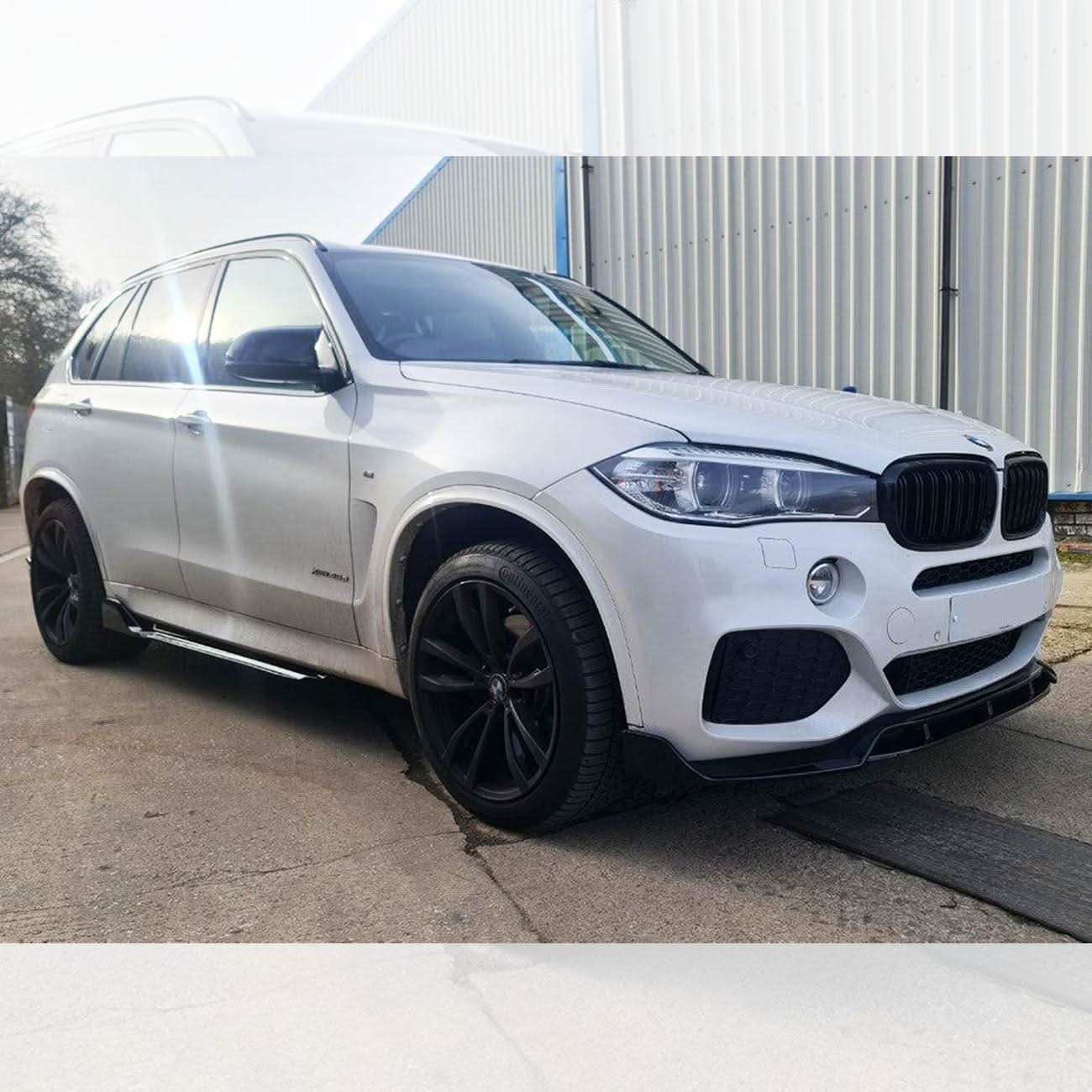 Gloss black BMW F15 X5 body kit with splitter, diffuser, side skirts, and spoiler, featuring carbon factory style design.