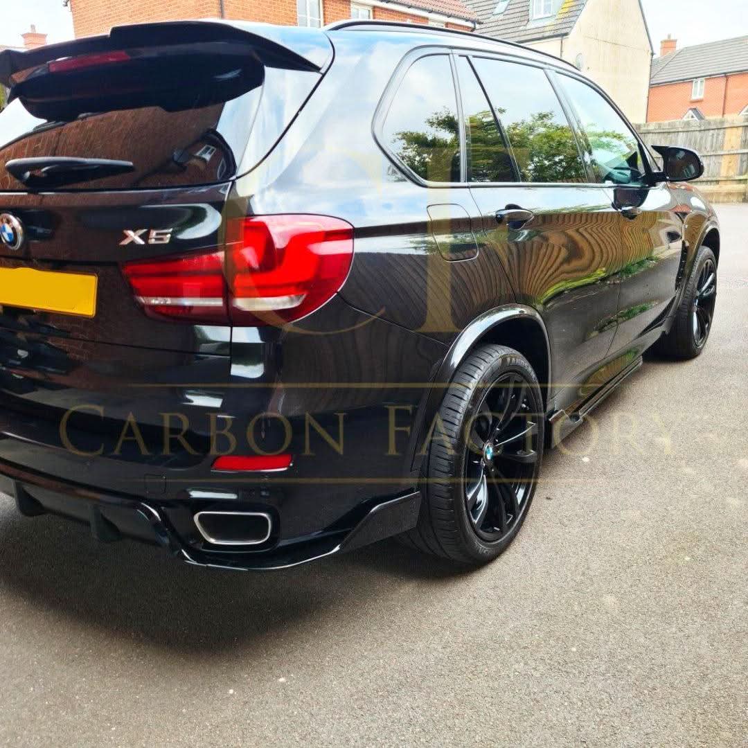 Gloss black BMW F15 X5 body kit including side skirts, splitter, diffuser, and spoiler with carbon factory style design.