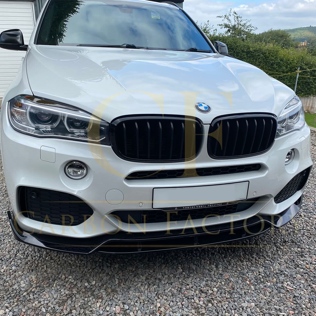 Gloss black BMW F15 X5 body kit with side skirts, splitter, diffuser, and spoiler, featuring a carbon factory style finish.