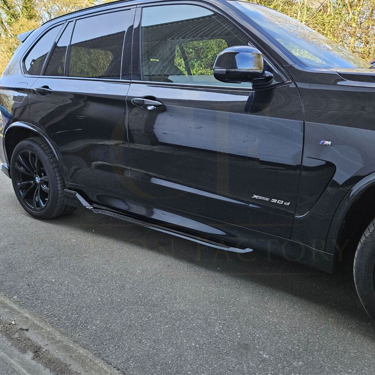 Gloss black BMW F15 X5 body kit with splitter, diffuser, side skirts, and spoiler, featuring a carbon factory style design.