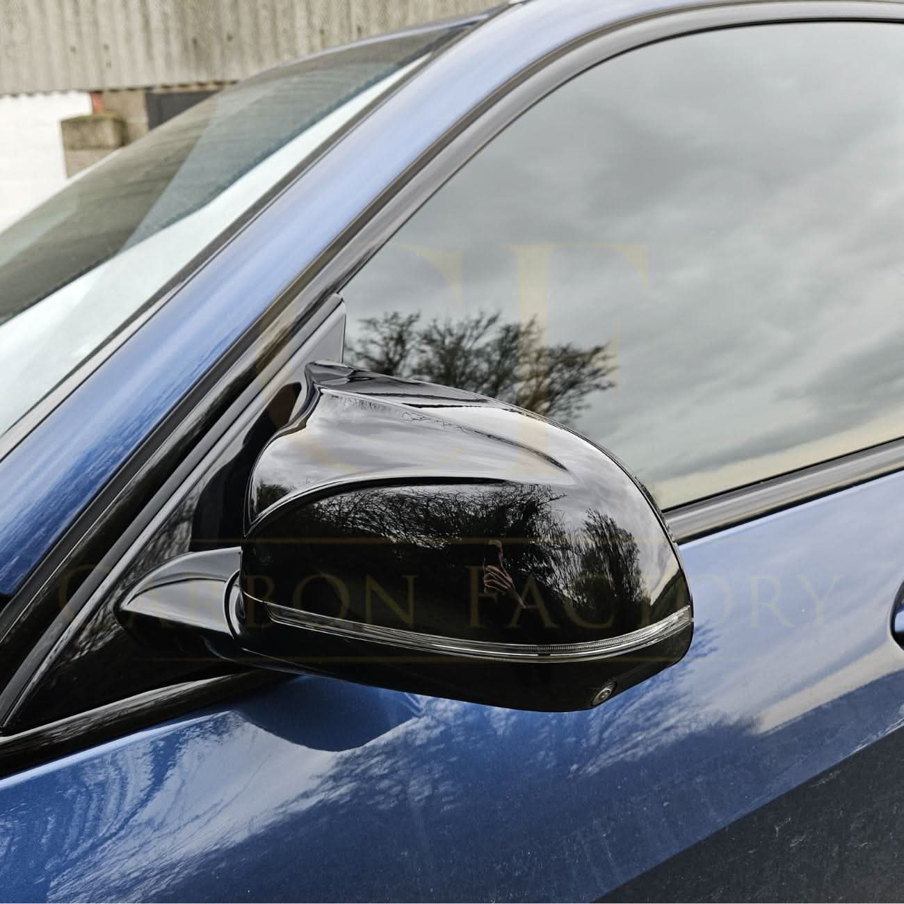 CF Style Gloss Black replacement mirror covers for BMW G01 X3 G02 X4 G05 X5 G06 X6 G07 X7 18-25 series, sleek and durable.