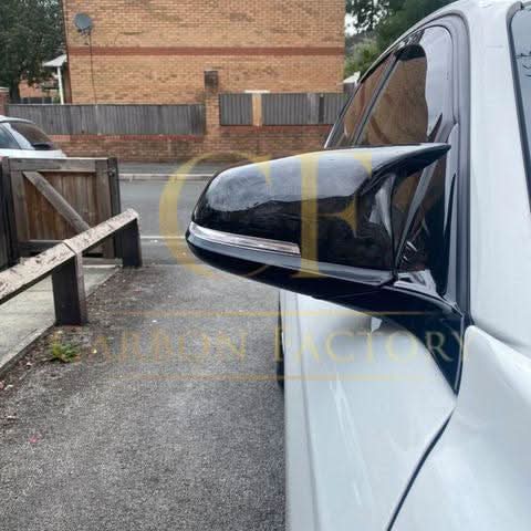 Gloss black M4-style replacement mirror covers for BMW 1, 2, 3, and 4 Series cars.