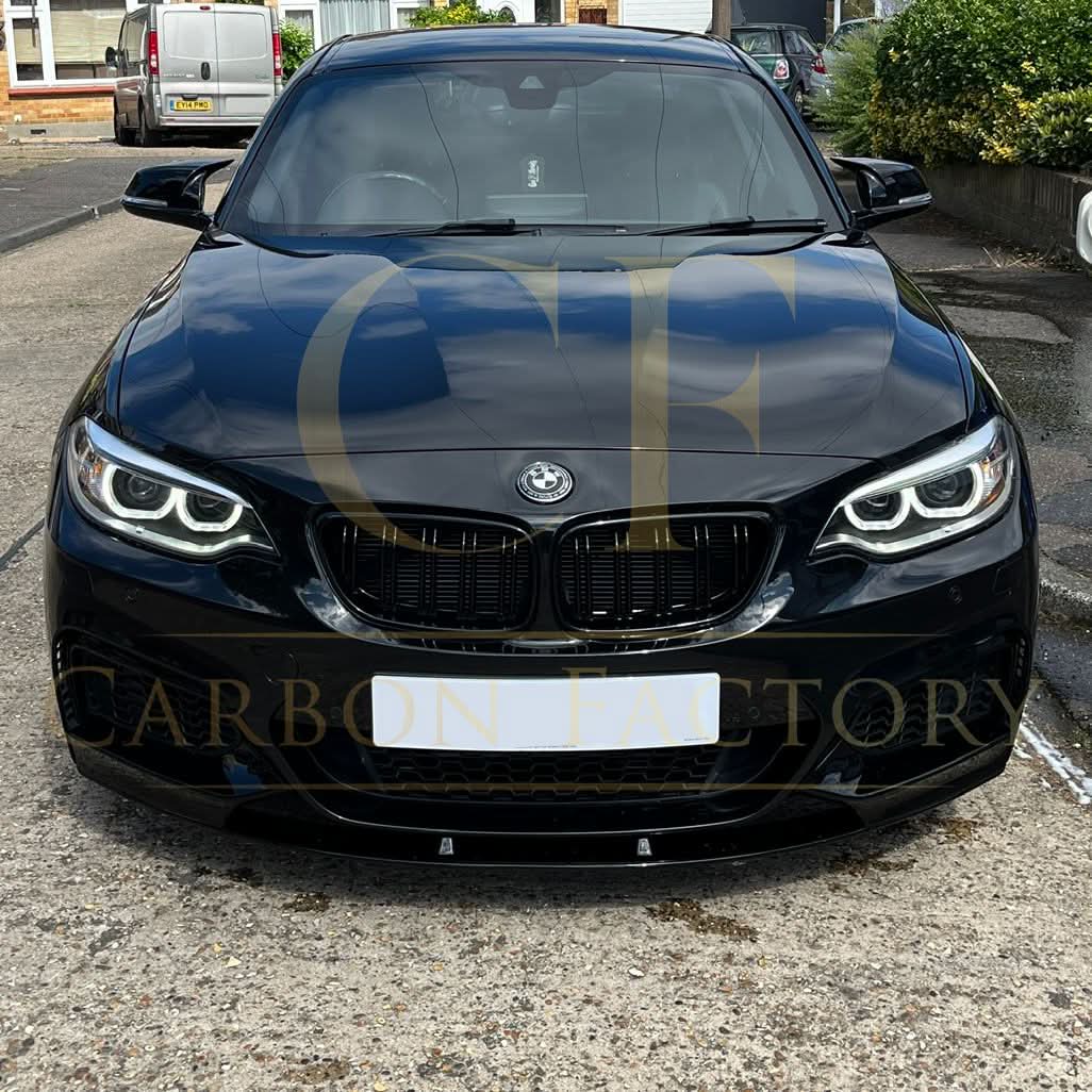 Gloss black M4-style replacement mirror covers for BMW 1, 2, 3, and 4 Series, showing sleek, glossy finish on car side mirrors.