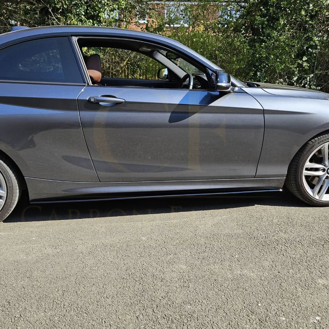 Gloss black side skirt for BMW F22 2 Series and F87 M2, MP Style, visible on the car's side profile.