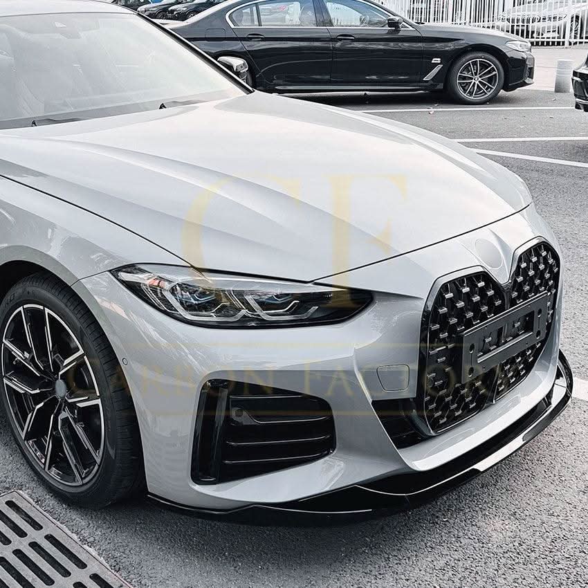 Gloss black front splitter for BMW 4 Series G26 Gran Coupe i4, MP Style, enhances sporty look and aerodynamic performance.