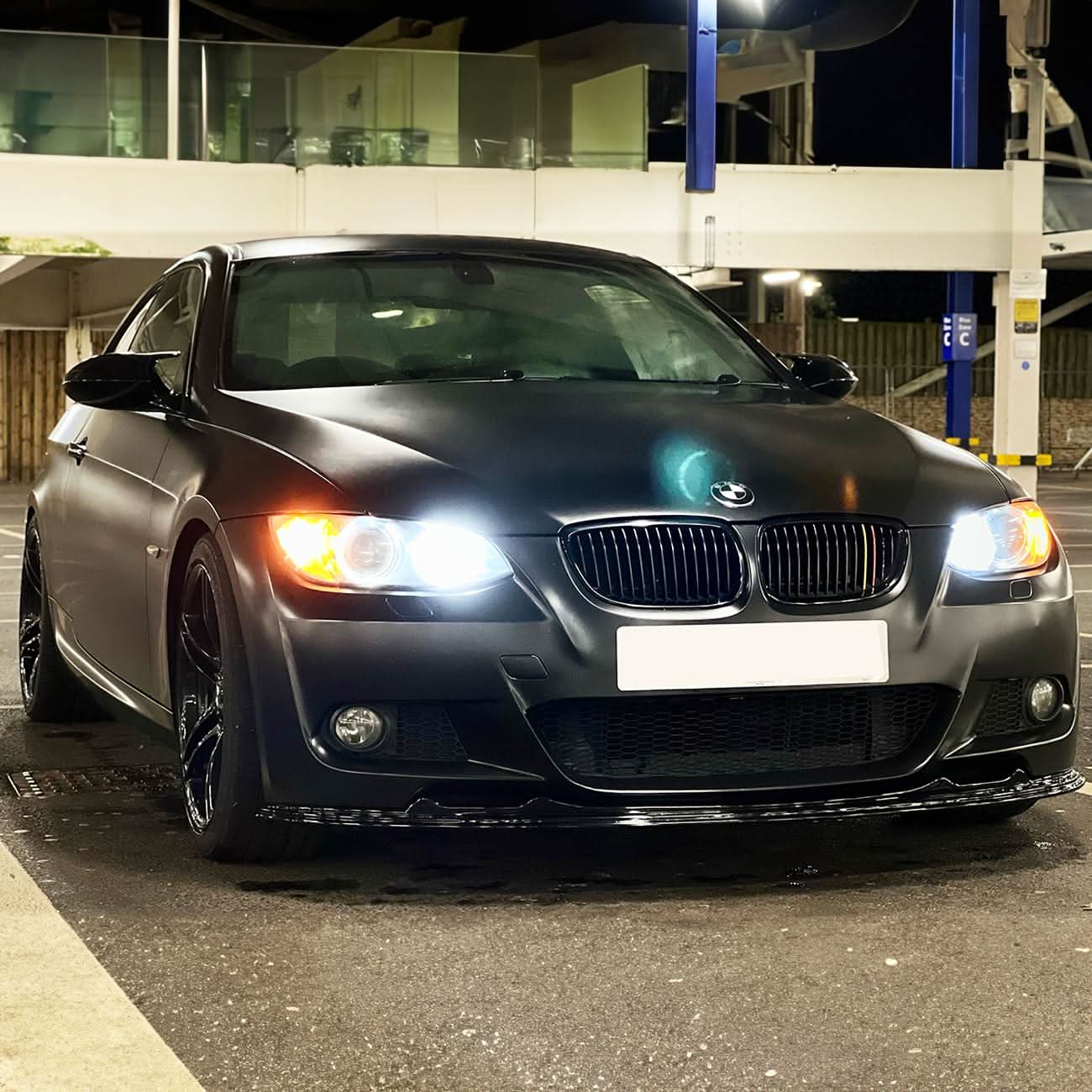 Gloss black MP Style front splitter for BMW E92 E93 3 Series 2006-2009, enhancing sporty appearance and aerodynamic performance.
