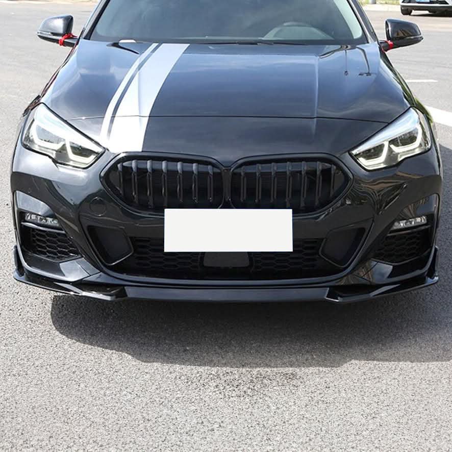 Gloss black front splitter for BMW F44 2 Series 4-door, MP Style, installed on the vehicle's front bumper.