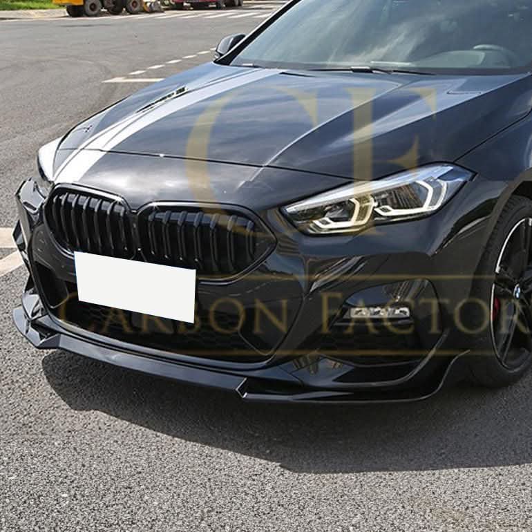 Gloss black MP Style front splitter installed on a BMW F44 2 Series 4-door, enhancing sporty exterior appearance.