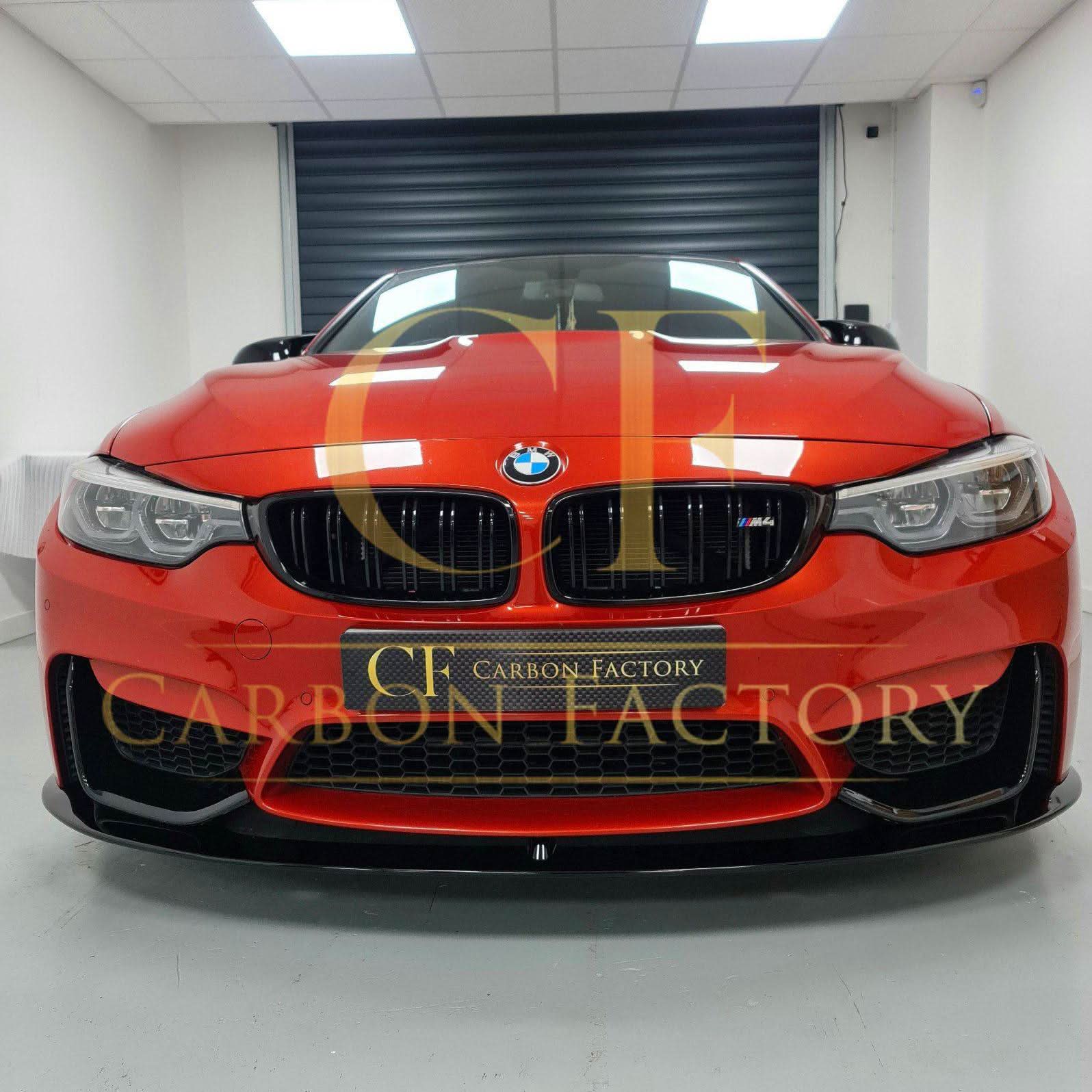 Gloss black MP style front splitter for BMW F80 M3 F82 F83 M4 14-20, shown attached to the front bumper.