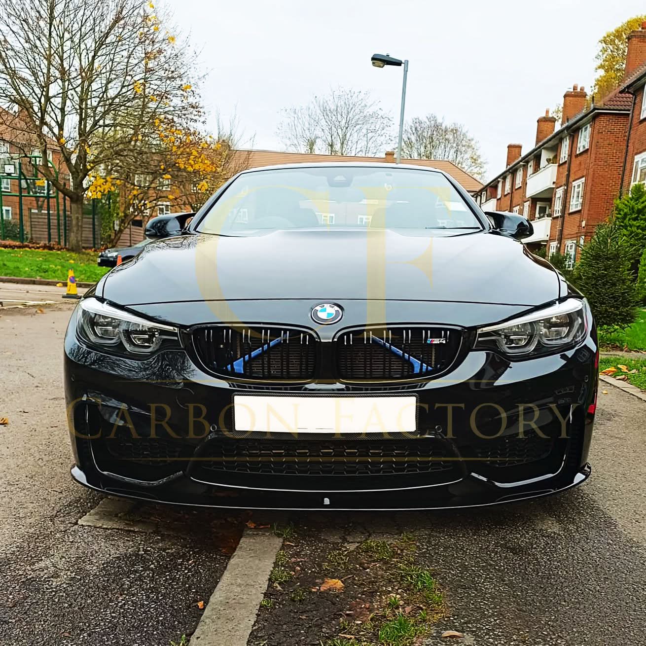 Gloss black MP Style front splitter for BMW F80 M3 F82 F83 M4 models, showing its aerodynamic design and fitment details.