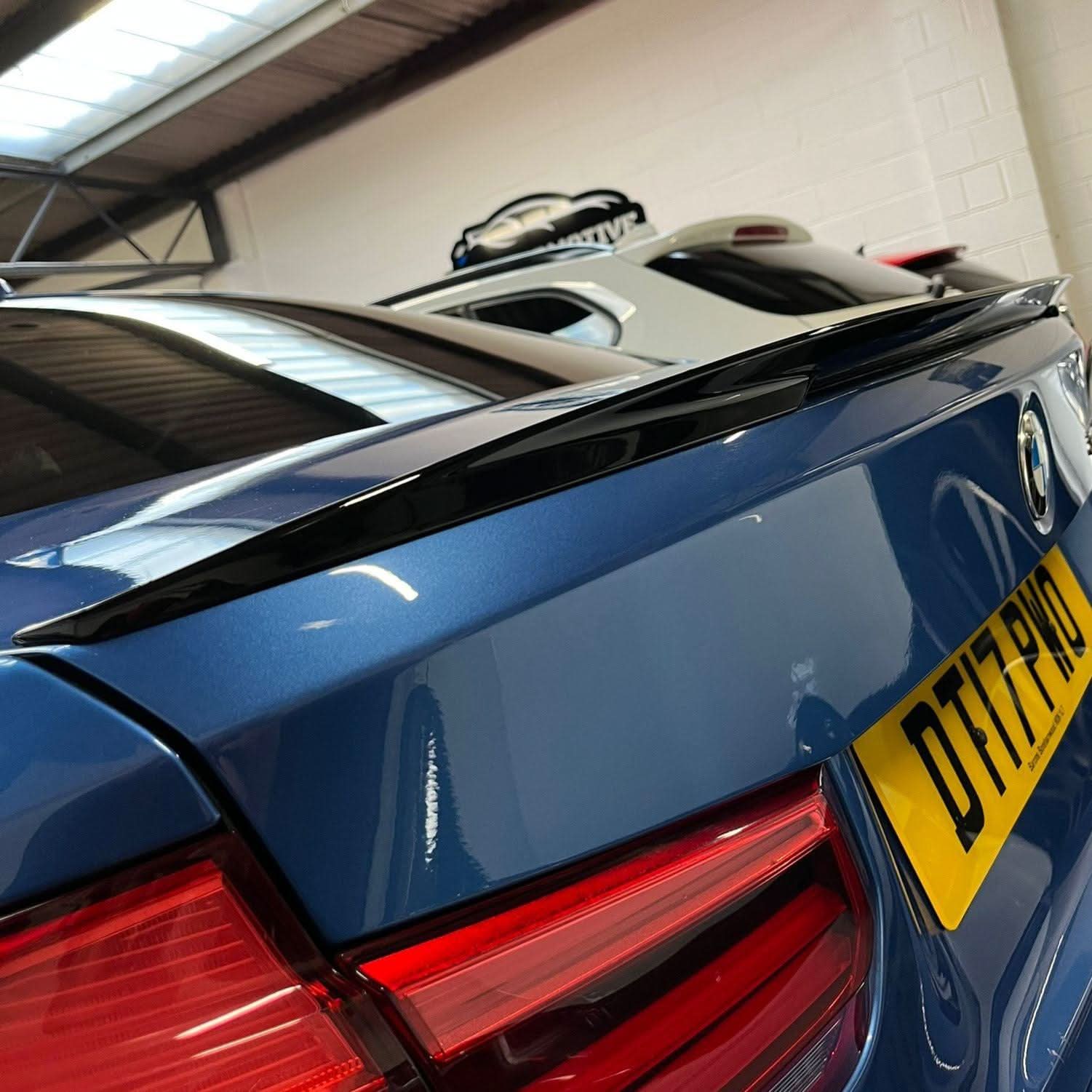 Gloss black MP Style boot spoiler for BMW 3 Series F30 F80 saloon, including M3 models, showcasing a sleek, aerodynamic design.