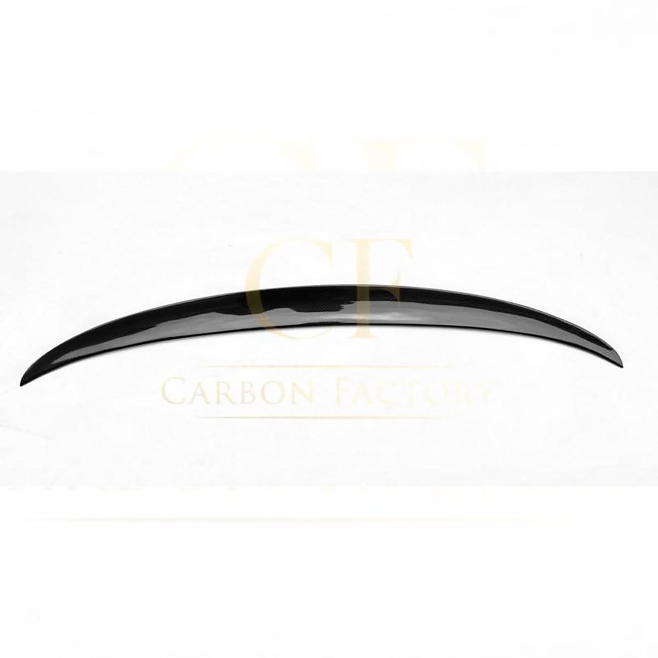 Gloss black boot spoiler for BMW G30 5 Series and F90 M5, MP Style, enhances rear sporty appearance, visible on the car's trunk lid.
