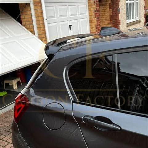 Gloss black roof spoiler for BMW F20 F21 1 Series, MP Style, mounted on the vehicle's roof for sporty enhancement.