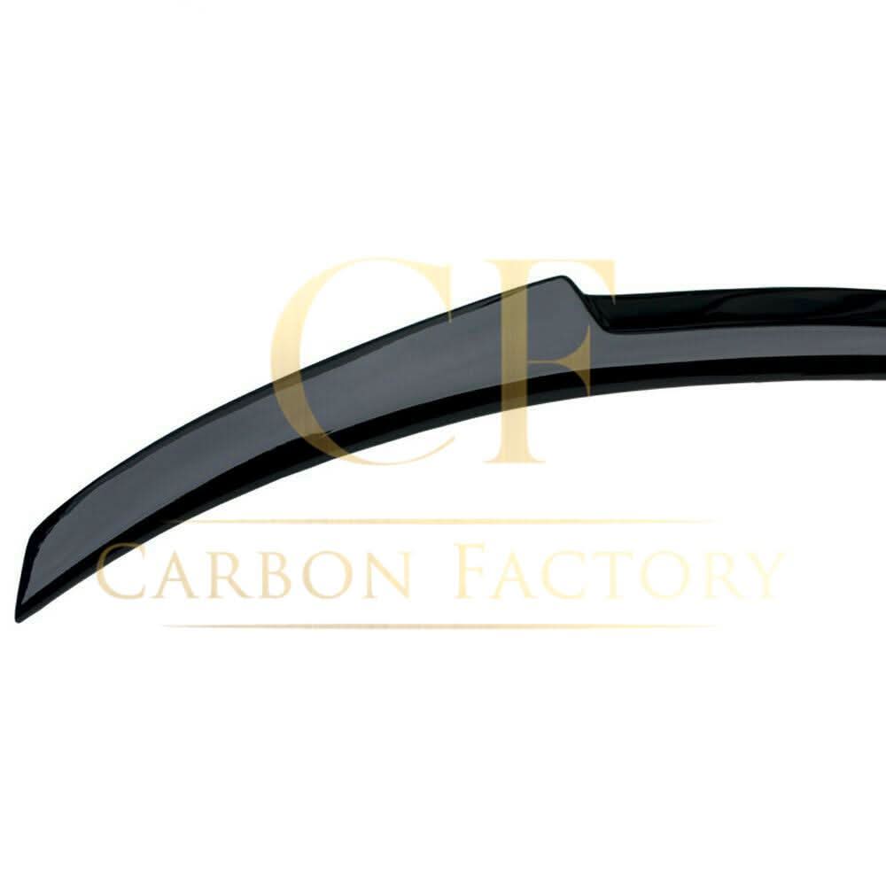 Gloss black V-style boot spoiler for BMW 4 Series F32 coupe (2014-2020), showcasing sleek aerodynamic design on the car's rear.