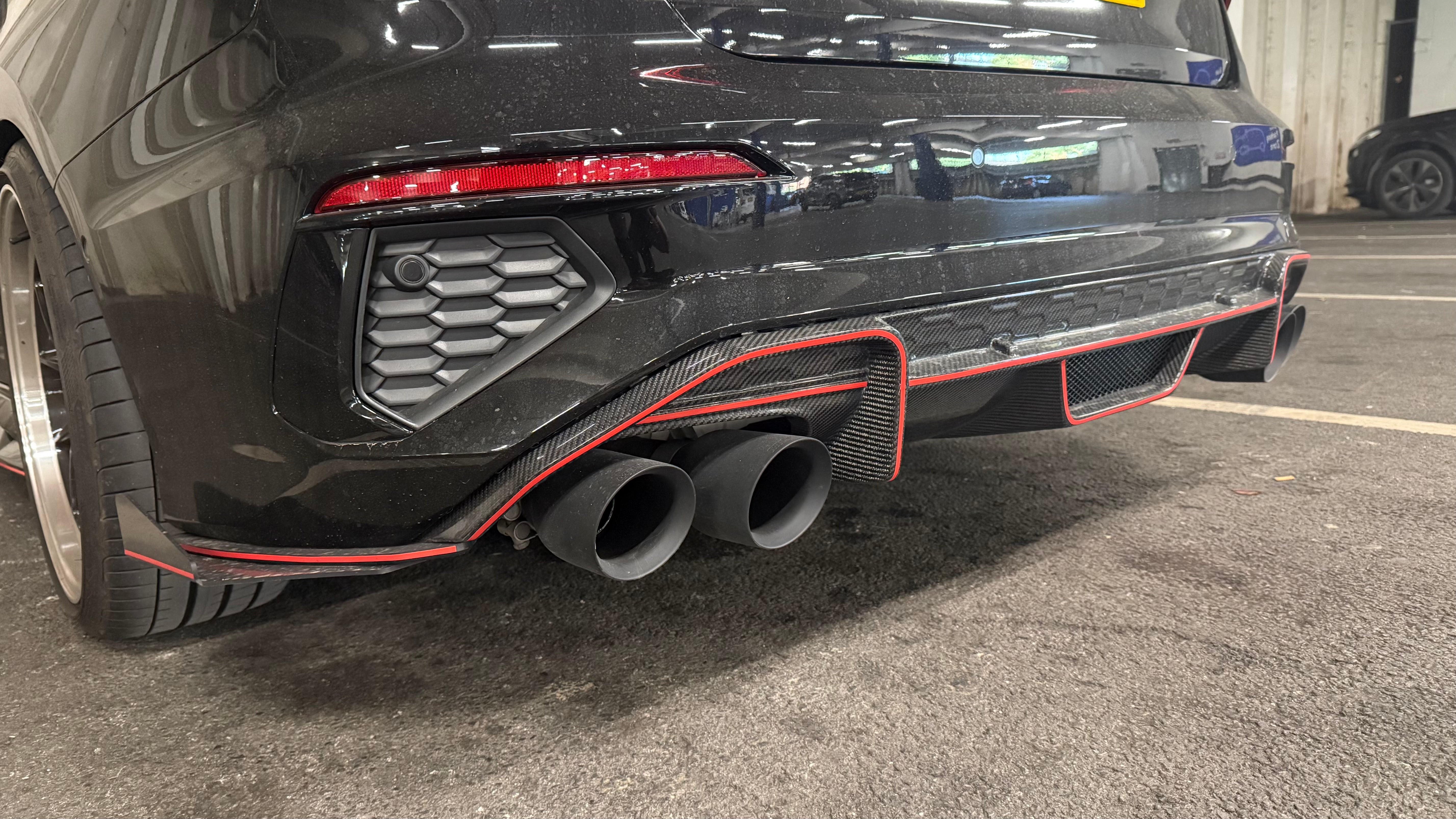Carbon Fibre V Style rear diffuser for Audi S3 Saloon 2021-present, showing sleek aerodynamic design and textured finish.
