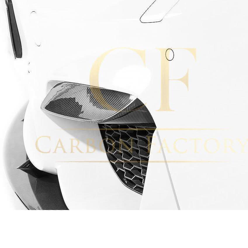 OEM-style carbon fibre front bumper trims for BMW F80 M3, F82, F83 M4, exterior trims by Pre-Preg Carbon, visible on the vehicle.