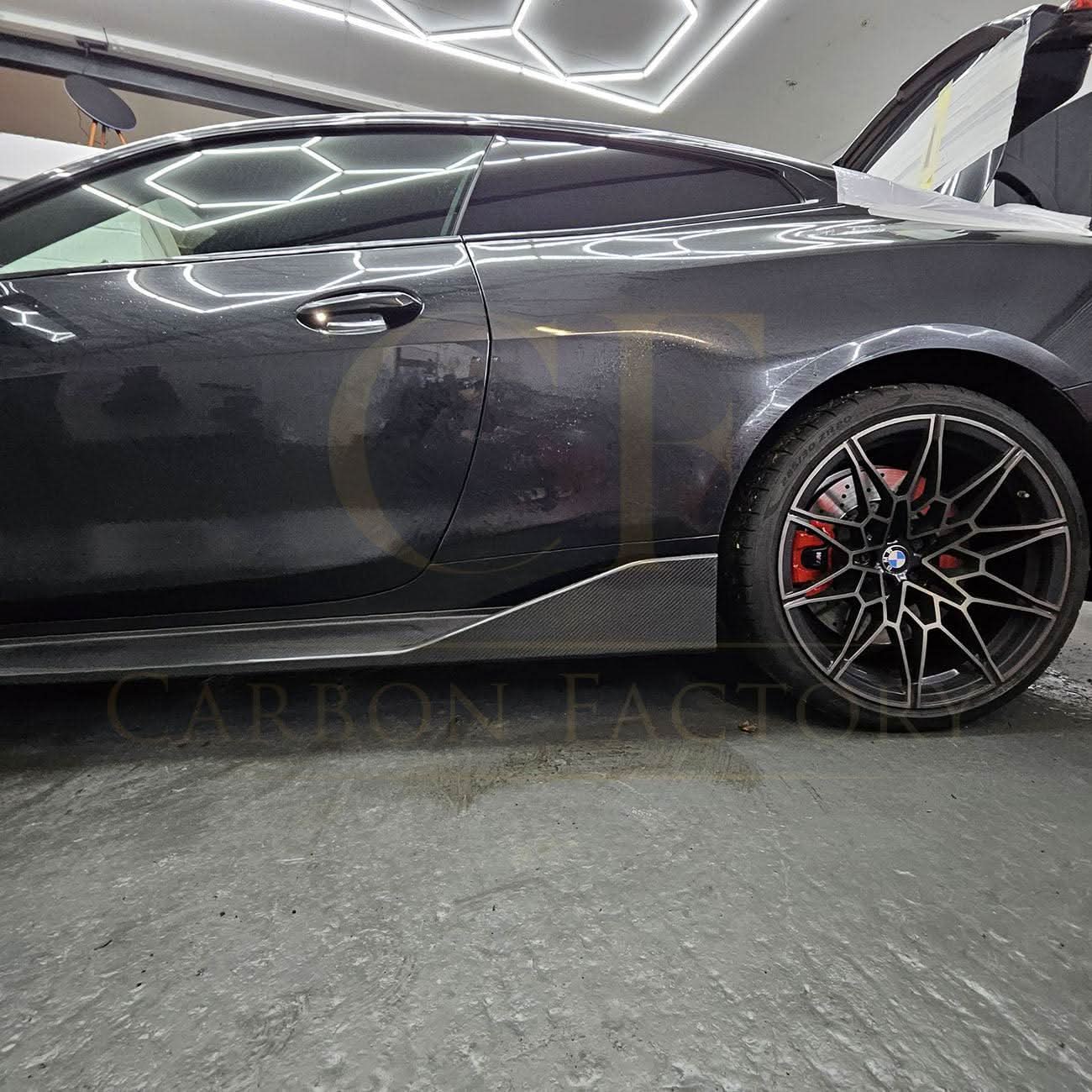 Pre-Preg Carbon fibre side skirts for BMW G82 G83 M4, sleek aerodynamic design, shown installed on the vehicle.