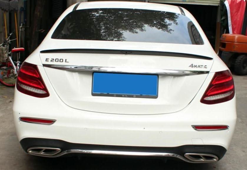 AMG-style Pre-Preg Carbon Fibre boot spoiler for Mercedes-Benz W213 E-Class saloon 2016-2023, showcasing sleek carbon fiber design.