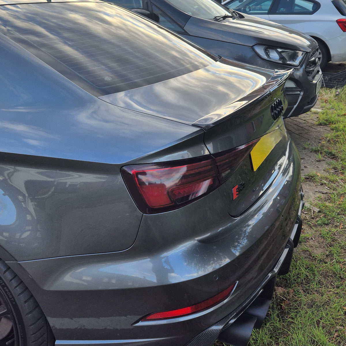 Carbon Fibre V Style boot spoiler for Audi A3 S3 RS3 saloon 2013-2020, shown installed on the vehicle's rear.
