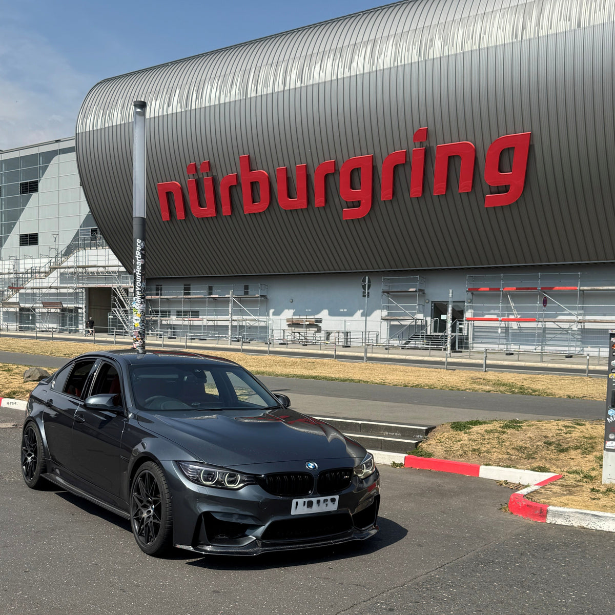 Carbon fibre front splitter for BMW F80 M3, F82 F83 M4 models, enhances aerodynamics and sporty appearance.